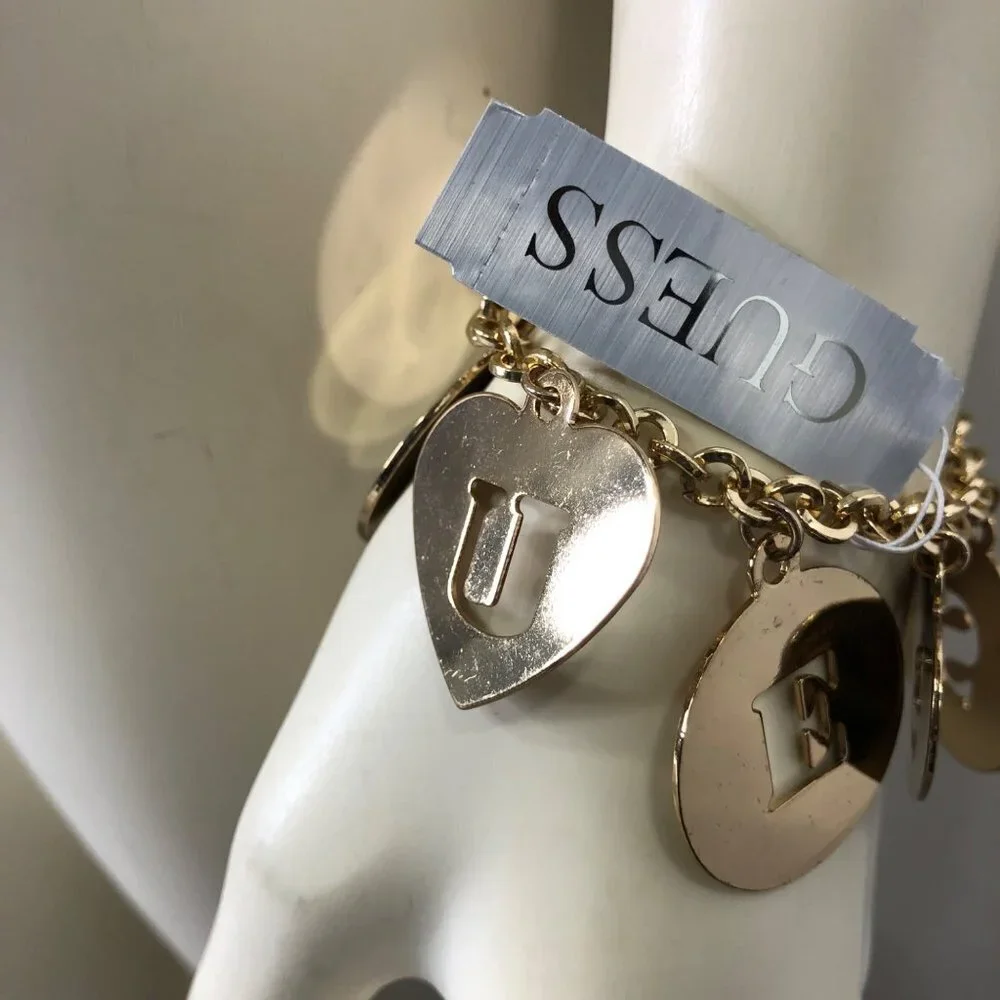 GUESS GOLD TONE LETTER CHARMS 7